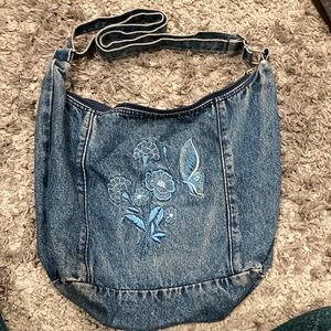 Jean purse with cute floral embroidered detail with adjustable strap